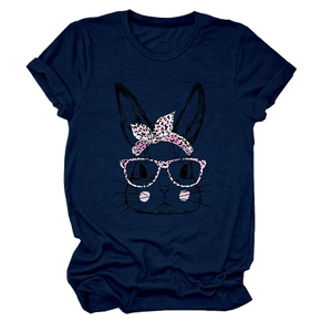Close-up of pink leopard print glasses and bow detail on navy rabbit graphic t-shirt