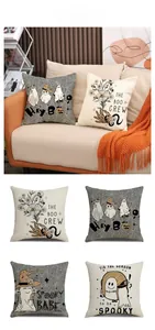 Detail view of four Halloween linen pillow covers with ghost and witch hat illustrations