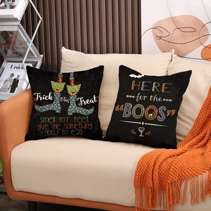 Halloween throw pillow covers set with Trick or Treat and Boo text on a sofa