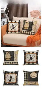 Detail of four Halloween pillow covers with witch hat and pumpkin prints on a sofa