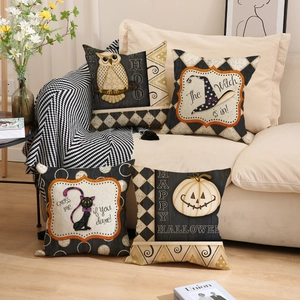 Set of four Halloween pillow covers with owl, witch hat, and pumpkin on beige sofa