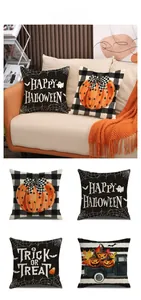 Detail showing four Halloween linen pillow covers with pumpkin and spider web prints