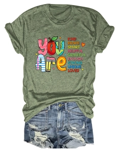Close-up of olive green t-shirt with You Are Kind Brave Smart inspirational text