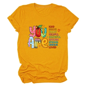 Close-up of the colorful inspirational text print on a ginger yellow cotton T-shirt