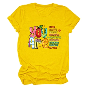 Close-up of colorful creative positive quote print on bright yellow cotton t-shirt
