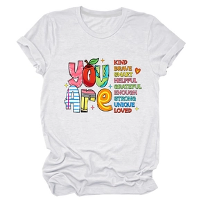 Detailed close-up of colorful inspirational text printed on a white cotton t-shirt