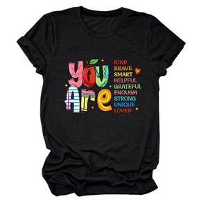 Detailed flat lay of black crewneck T-shirt with You Are Kind Brave Smart colorful text print