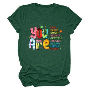 Close-up of inspirational letters on deep green cotton t-shirt with crew neck