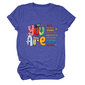 Flat lay of royal blue short sleeve T-shirt with You Are Kind Brave printed text