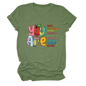 Close-up of military green crew neck t-shirt with colorful You Are Kind Brave text print