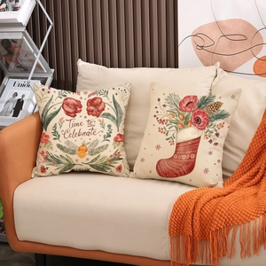 Christmas cushion covers with 'Time to Celebrate' and festive stocking prints on a sofa