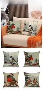 Close-up of four vintage linen pillow covers with festive winter birds and berry motifs