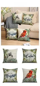 Detail view of four linen Christmas pillow covers featuring winter birds and pine motifs