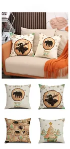 Close-up of linen pillow covers with winter Christmas deer and bear forest patterns