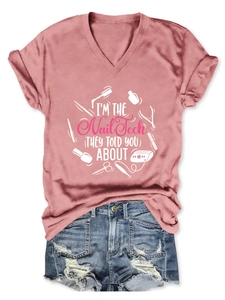 Close-up of pink V-neck Nail Tech T-shirt paired with ripped denim shorts in flat lay