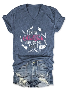 Detail of grey V-neck T-shirt with Nail Tech graphic and distressed denim shorts