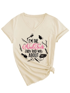 Detail of V-neck cotton T-shirt with I'M THE Nail Tech graphic and knot at hem