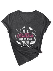 Detail of V-neck dark grey t-shirt featuring I'm The Nail Tech graphic with pink tools