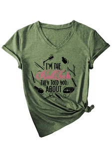 Detail of army green heather V-neck T-shirt with I'M THE Nail Tech slogan and knot tie