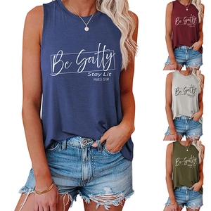 Detail view of cotton tank tops in navy, burgundy, grey, and olive with printed lettering