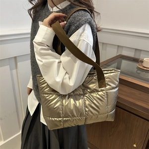 Champagne gold quilted tote bag with brown woven handles for women in winter fashion