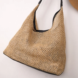 Minimalist straw woven tote bag with black leather trim and large mesh hollow design