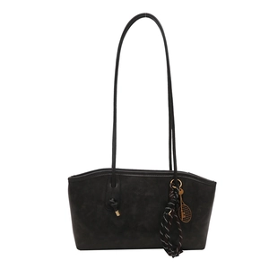 Large dark grey tote bag with thin shoulder straps and decorative striped silk scarf