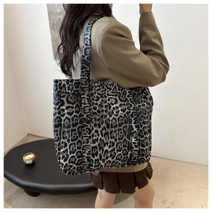 Chic leopard print tote bag styled with a professional suit for daily commute