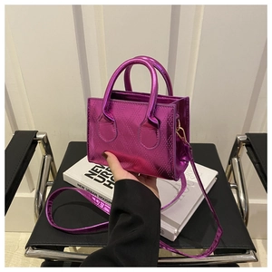 Macro detail of metallic purple quilted mini tote bag with glossy rhombus pattern