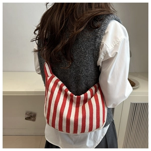 Detail view of red and white striped canvas tote bag showing thick cotton fabric and texture