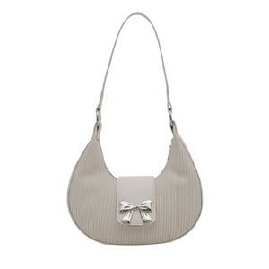 Chic off-white pleated hobo bag with a silver bow accent and metallic chain strap