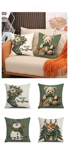 Detail view of linen Christmas pillow covers featuring bears and reindeer patterns