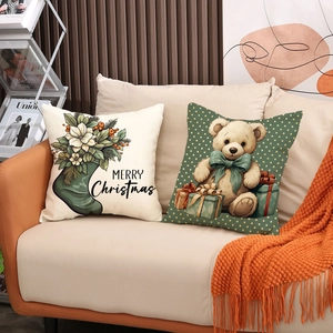 Set of two Christmas decorative linen pillow covers featuring a festive teddy bear and florals
