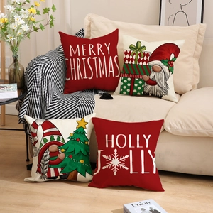 Set of four Christmas gnome pillows with Merry Christmas text on a cozy beige sofa