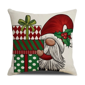 Christmas gnome throw pillow cover with festive gift boxes on cream linen background