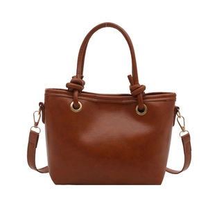 Sac à main vintage marron caramel avec poignées nouées et gaufrage de mode en similicuir