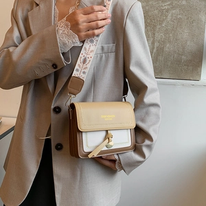 Chic tricolor square crossbody bag with ethnic embroidered strap and logo detail