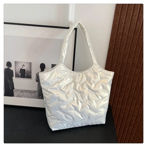 Pearl white quilted puffer tote bag with glossy finish and stylish shoulder strap