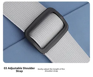 Macro detail of adjustable grey nylon shoulder strap and black buckle on blue travel bag