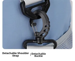 Macro detail of the detachable swivel hook and gray shoulder strap on a blue gym bag