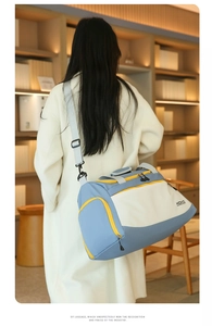 Close-up of waterproof travel bag featuring side zipper pocket and brand logo detail