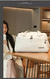 Detail of white nylon travel bag with brand logo and durable sport mesh pocket