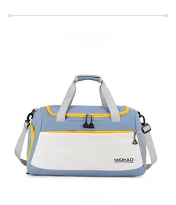 Front view of a blue and white fitness bag with yellow zippers and waterproof fabric