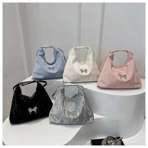Collection of metallic butterfly tote bags in light blue, cream, pink, black and silver