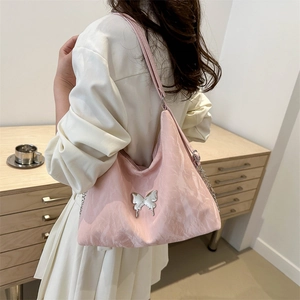 Pink pleated hobo bag with silver butterfly buckle and adjustable crossbody strap