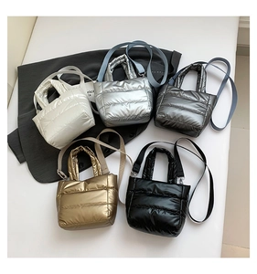 Quilted puffer bags in five metallic colors featuring shoulder straps and light texture