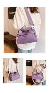 Close-up of lightweight purple nylon fitness bag showing wide shoulder strap and triangular zipper