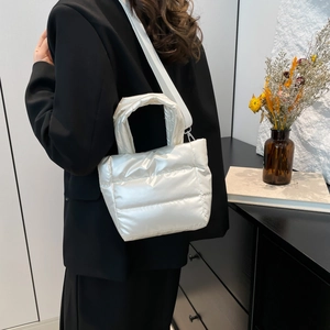 Minimalist white quilted puffer handbag and crossbody bag for autumn winter fashion style