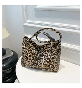 Detail of trendy leopard print tote bag texture and soft rectangular structure