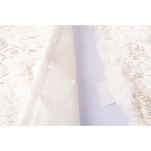 White plush Christmas tree skirt with gold tinsel and functional velcro closure detail
